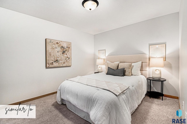 carpeted bedroom featuring baseboards