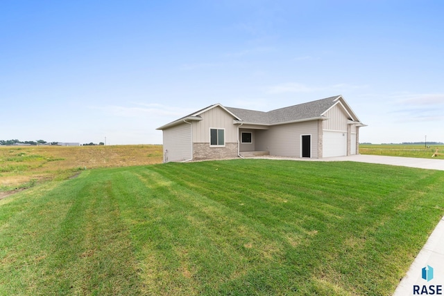 ranch-style home with driveway, a front lawn, board and batten siding, and an attached garage