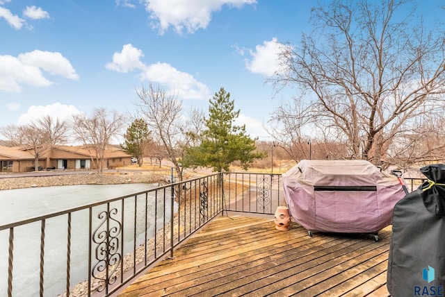 wooden terrace featuring grilling area