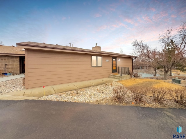 single story home with a chimney