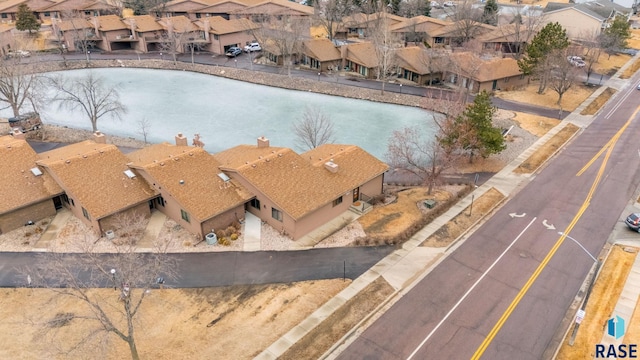 birds eye view of property with a residential view