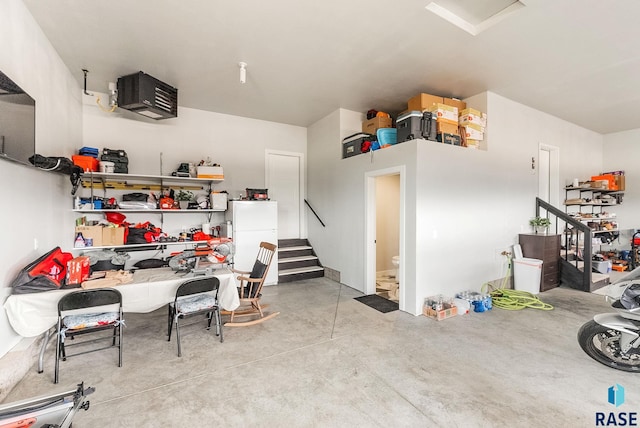 garage with freestanding refrigerator