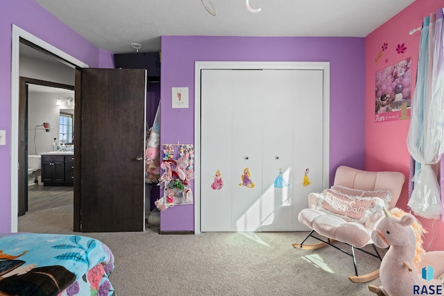 carpeted bedroom featuring a closet