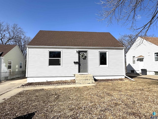 view of front of house with a shingled roof