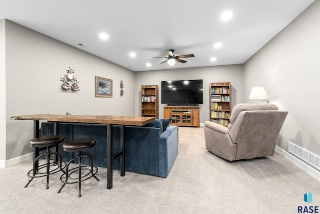 living area with recessed lighting, visible vents, light carpet, ceiling fan, and baseboards