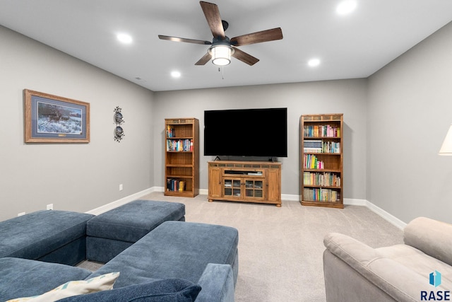 living room with recessed lighting, light carpet, ceiling fan, and baseboards