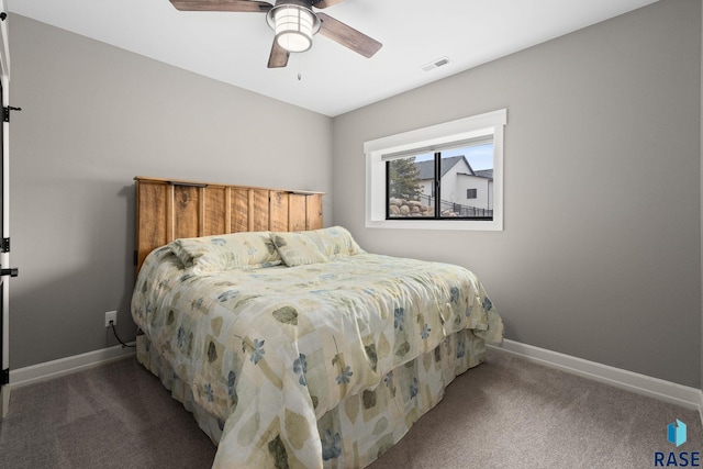 bedroom featuring baseboards, visible vents, and carpet flooring