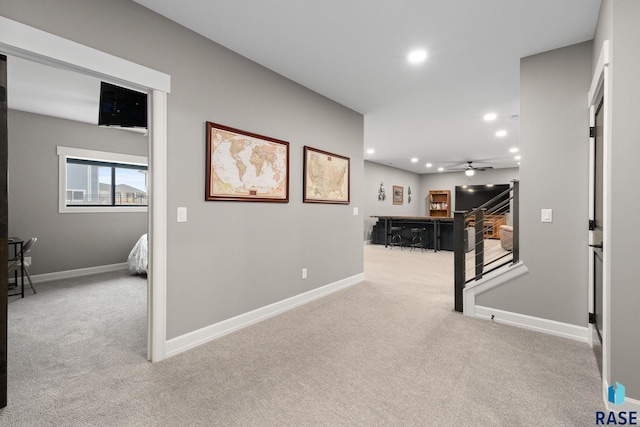 hall with recessed lighting, carpet flooring, stairway, and baseboards