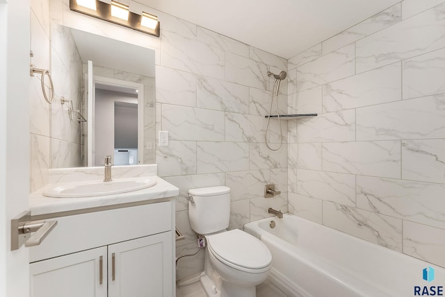 bathroom with toilet, vanity, tile walls, and shower / bathing tub combination