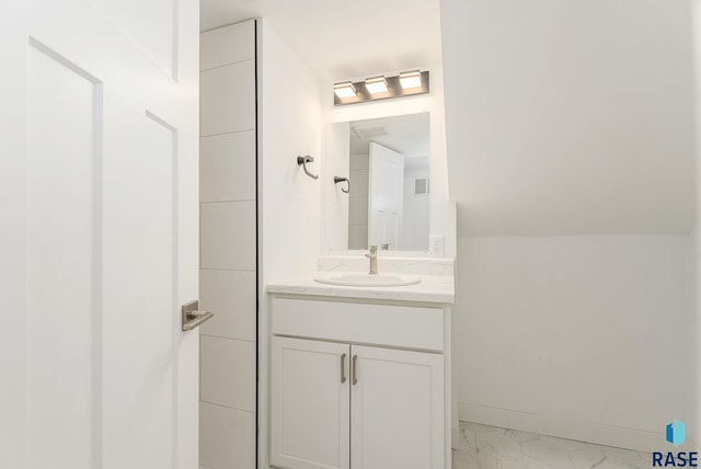 bathroom featuring vanity and baseboards