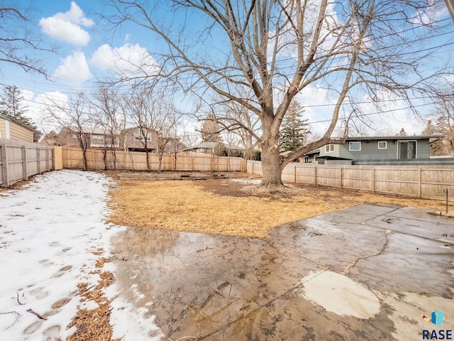 view of yard with a patio area and a fenced backyard