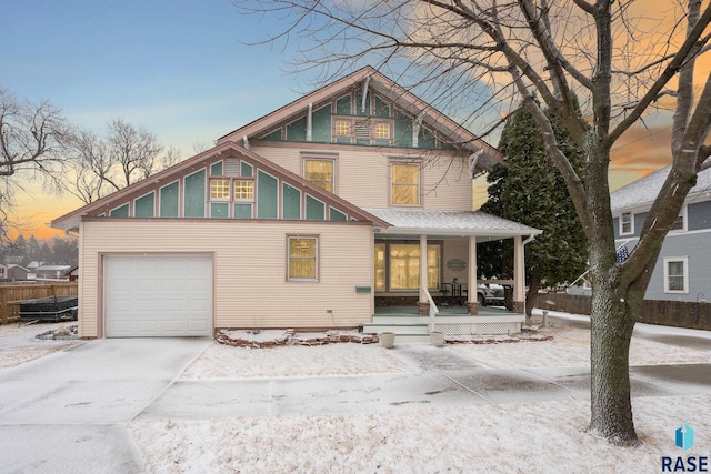 view of front facade featuring driveway and a porch