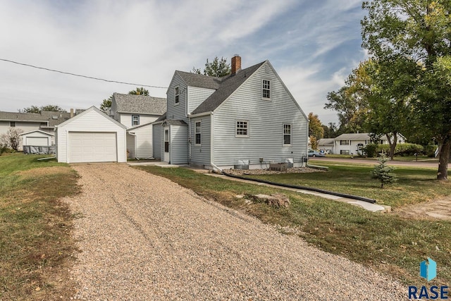 view of front of property with a garage, dirt driveway, a chimney, an outdoor structure, and a front yard