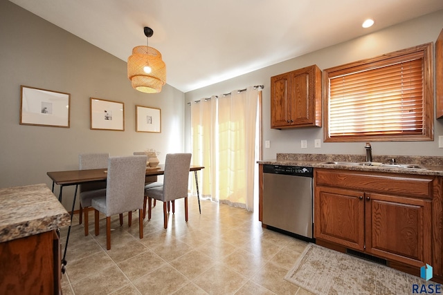 kitchen with lofted ceiling, visible vents, brown cabinets, and dishwasher