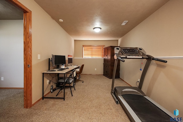 carpeted office with visible vents and baseboards