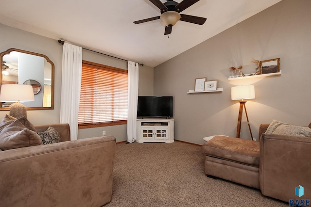 carpeted living room featuring baseboards, vaulted ceiling, and a ceiling fan