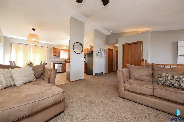 living room featuring light carpet, ceiling fan, and vaulted ceiling