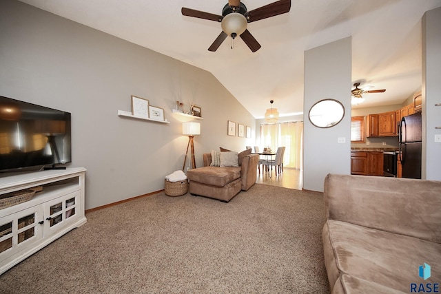 living room with lofted ceiling, carpet floors, ceiling fan, and baseboards