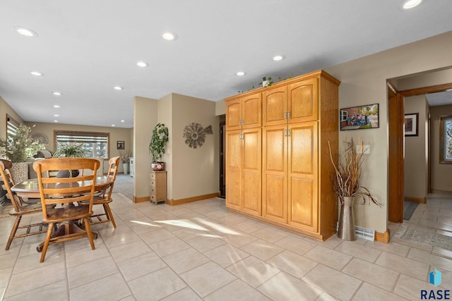 dining area featuring light tile patterned floors, baseboards, and recessed lighting