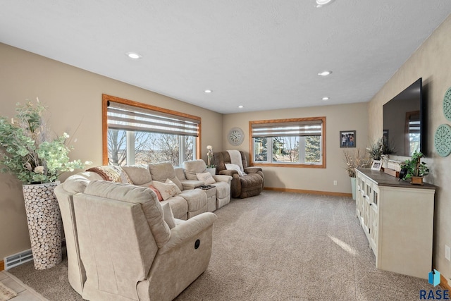 living area with light carpet, recessed lighting, visible vents, and baseboards