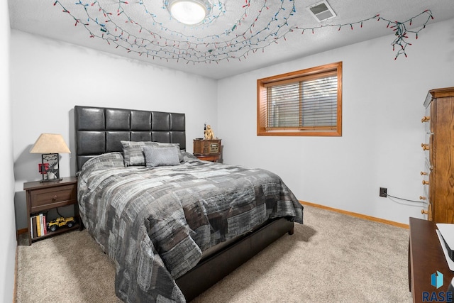 bedroom with carpet flooring, visible vents, and baseboards