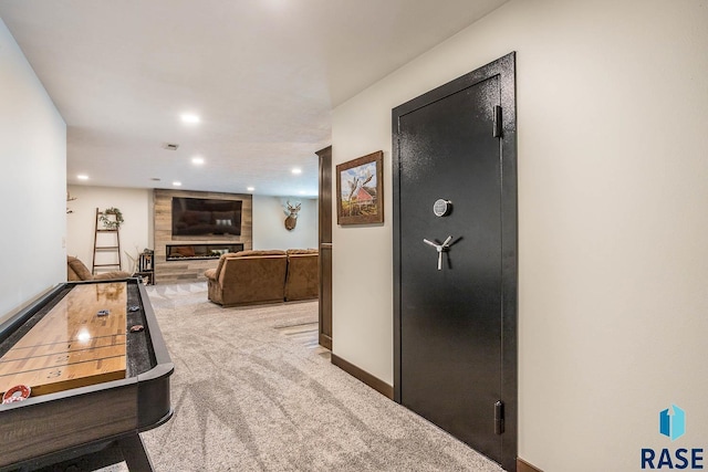 game room with a large fireplace, baseboards, carpet flooring, and recessed lighting