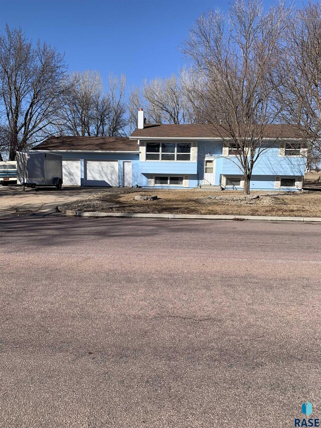 view of front of property featuring a chimney