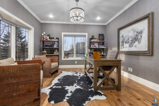 office space featuring an inviting chandelier, baseboards, crown molding, and wood finished floors