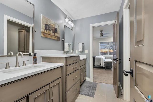 ensuite bathroom featuring ensuite bath, tile patterned flooring, ceiling fan, and vanity