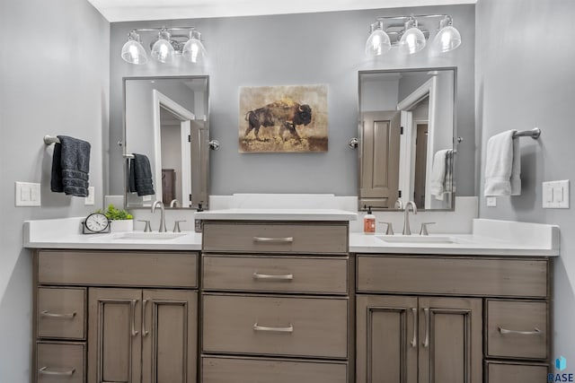 bathroom with a sink and two vanities