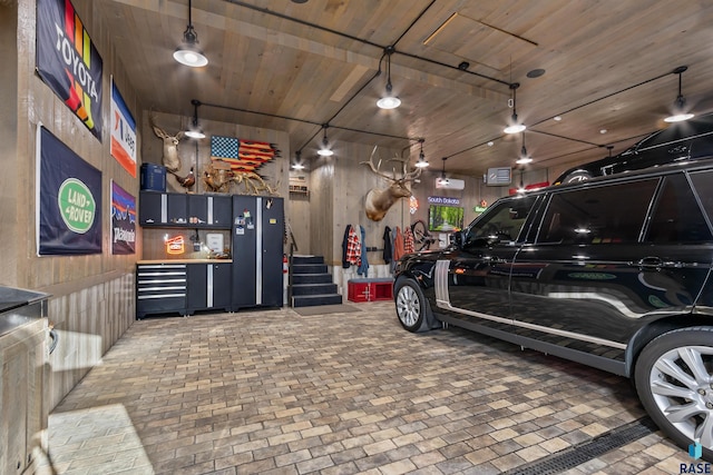 garage featuring wooden ceiling