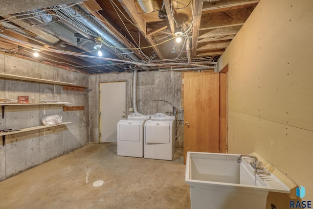 unfinished below grade area featuring separate washer and dryer