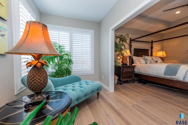 bedroom with baseboards and light wood-style floors