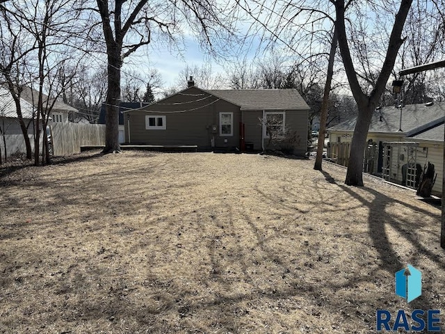 view of front of house with fence