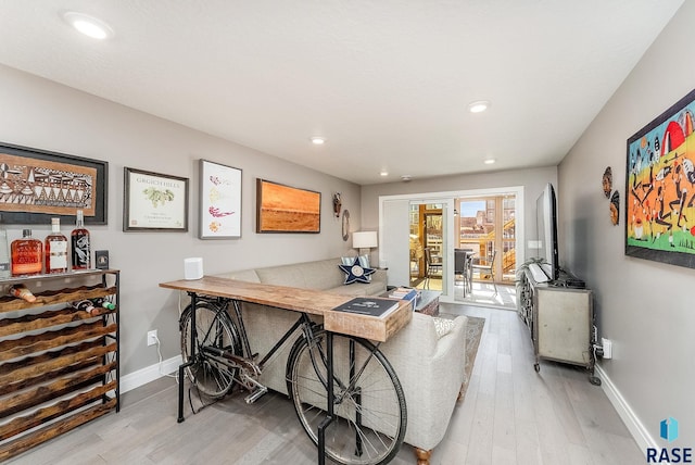 office space with recessed lighting, wood finished floors, and baseboards