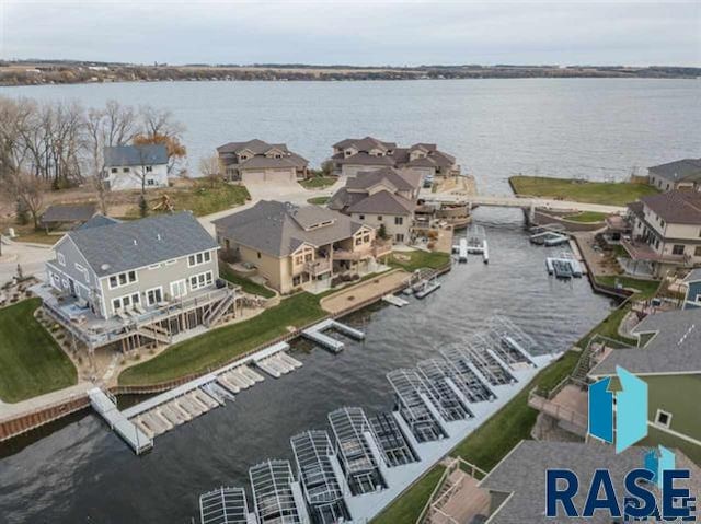 bird's eye view with a water view and a residential view