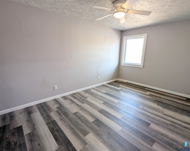 spare room with ceiling fan, a textured ceiling, baseboards, and wood finished floors