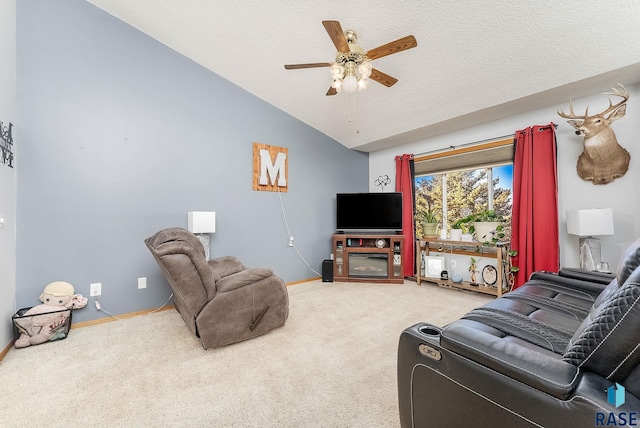 carpeted living room featuring baseboards, lofted ceiling, a textured ceiling, and a ceiling fan