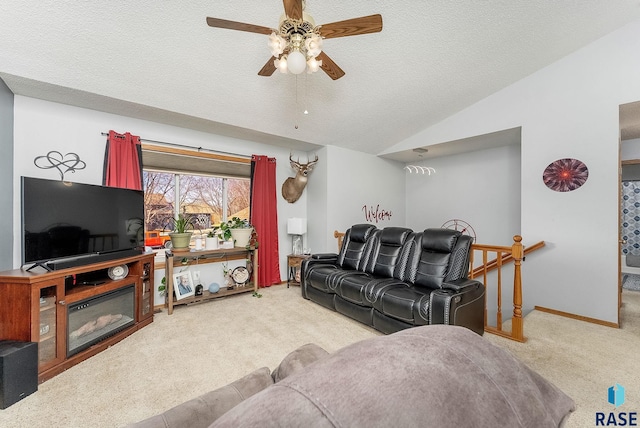 living room featuring baseboards, a textured ceiling, lofted ceiling, and carpet