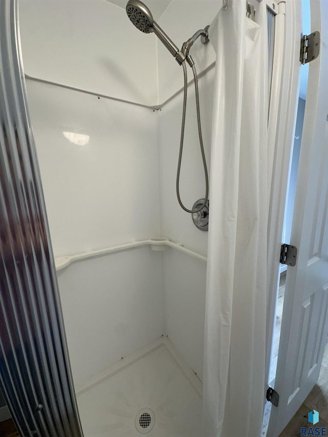 full bathroom with a shower stall