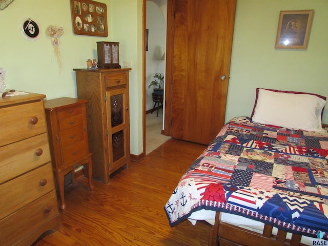 bedroom featuring wood finished floors