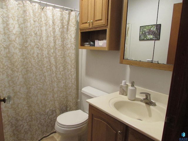 bathroom featuring vanity, toilet, and a shower with curtain