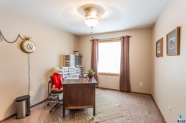 home office with baseboards, ceiling fan, and carpet flooring