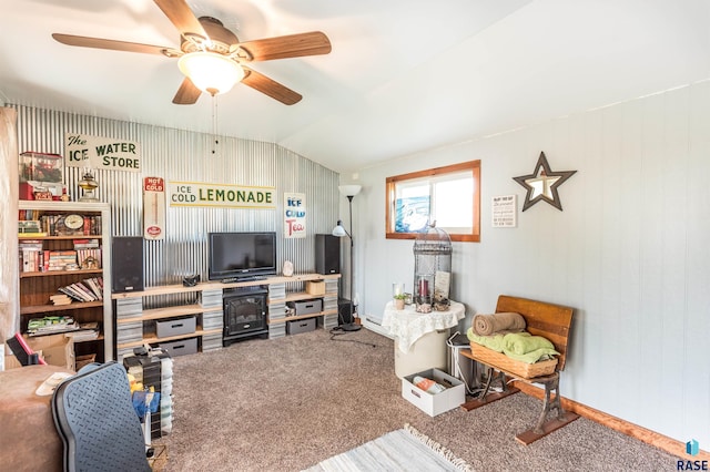 carpeted living area with lofted ceiling and a ceiling fan