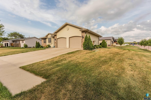 ranch-style house featuring a front lawn, brick siding, a garage, and driveway