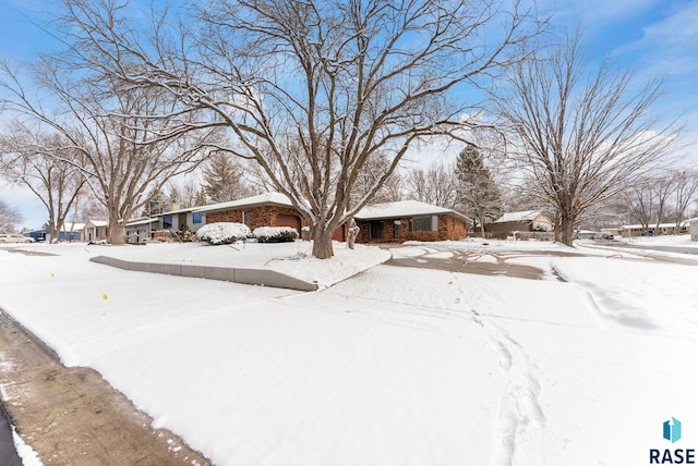 view of yard layered in snow