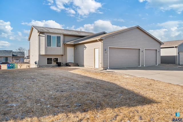 split level home with a garage and driveway