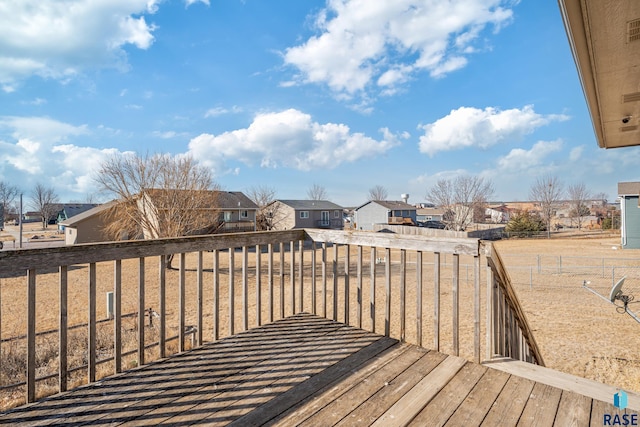 wooden deck featuring a residential view