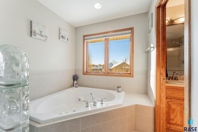 bathroom featuring a whirlpool tub and a sink