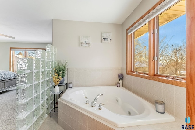 full bathroom featuring a jetted tub